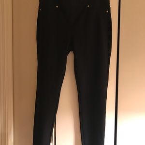 Black form fitting pants